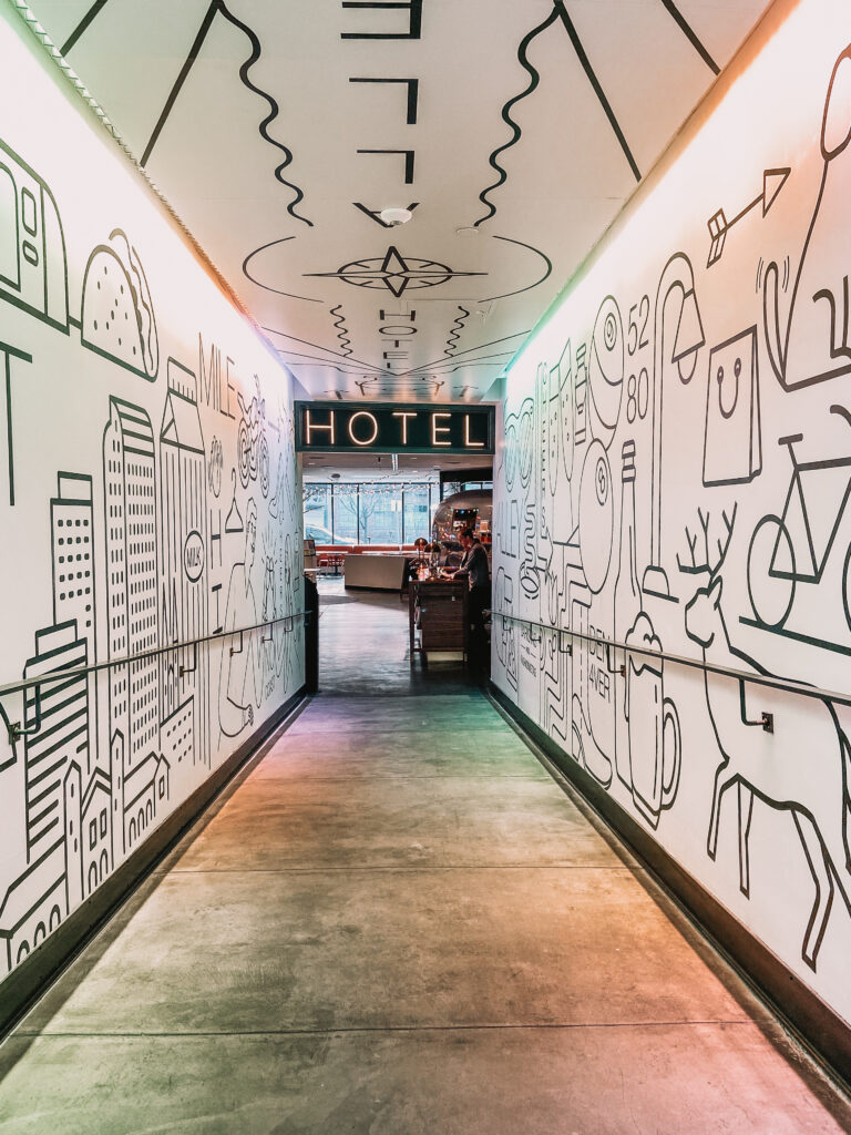 Diagnostic review of the guest arrival experience at The Maven Denver, analyzing the transition from The Alley's industrial-chic public space into the boutique lobby's spatial UX.